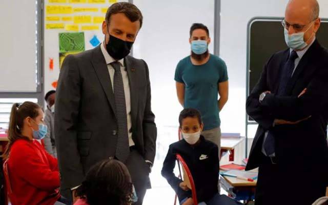 French President Emmanuel Macron slapped in the face.