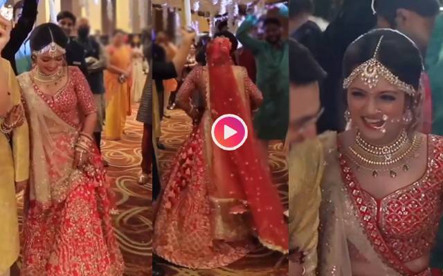 Desi bride enters wedding venue