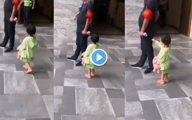 Toddler reminds security guard about her temperature