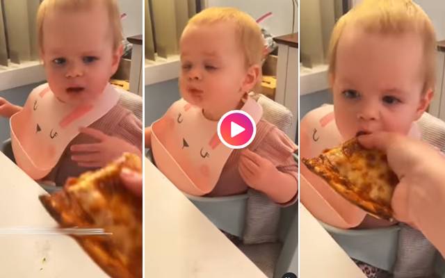 Baby girl tastes pizza for the first time