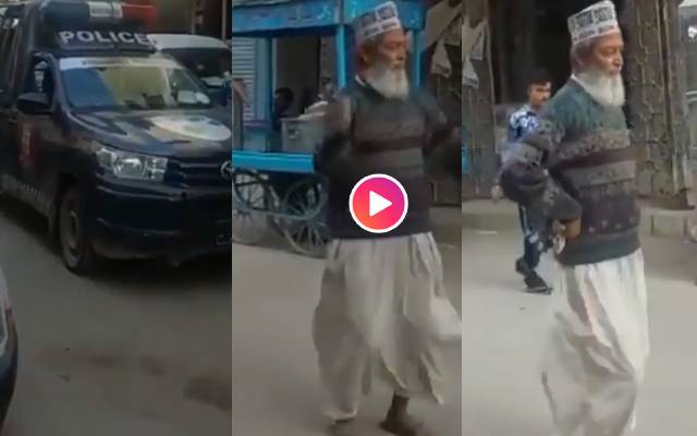 old man dance in frount of police van