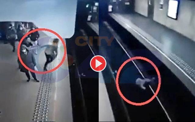 Pushes Woman in front of Train