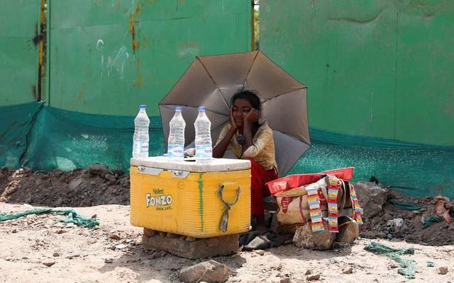 girl selling mineral water