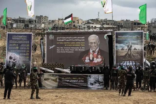 Khan Yunes camp, Hamas exhibiting the coffins of their victims, city42, Gaza ceasefire, Sheri Bibas, Kafer Bibas, Ariel Bibas, Israel Hamas conflict 
