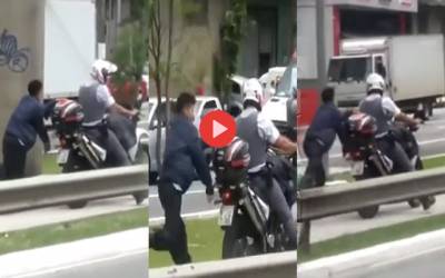 suspected drug trafficker was handcuffed to a police motorbike